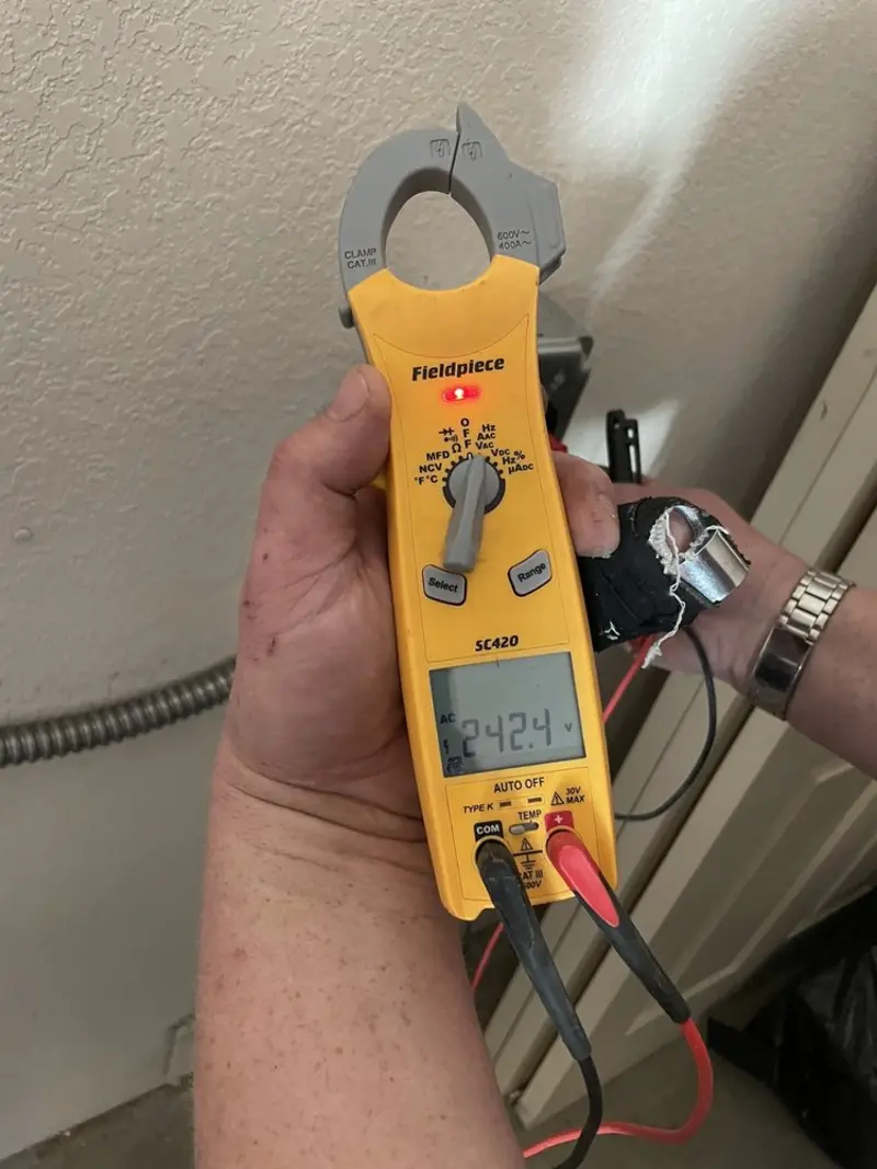 Voltage testing with clamp meter during Electrical Installation Services in La Habra